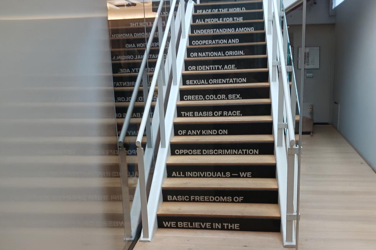 A staircase in the Scholastic office in NYC has a poem about the company culture written on the stairs