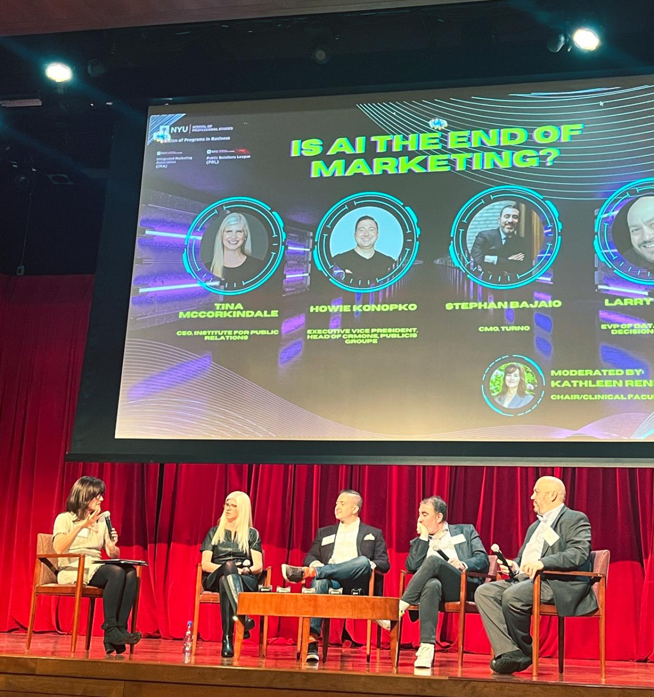 Five panelists participate in a session titled "Is AI the End of Marketing?" at the AI Summit. 