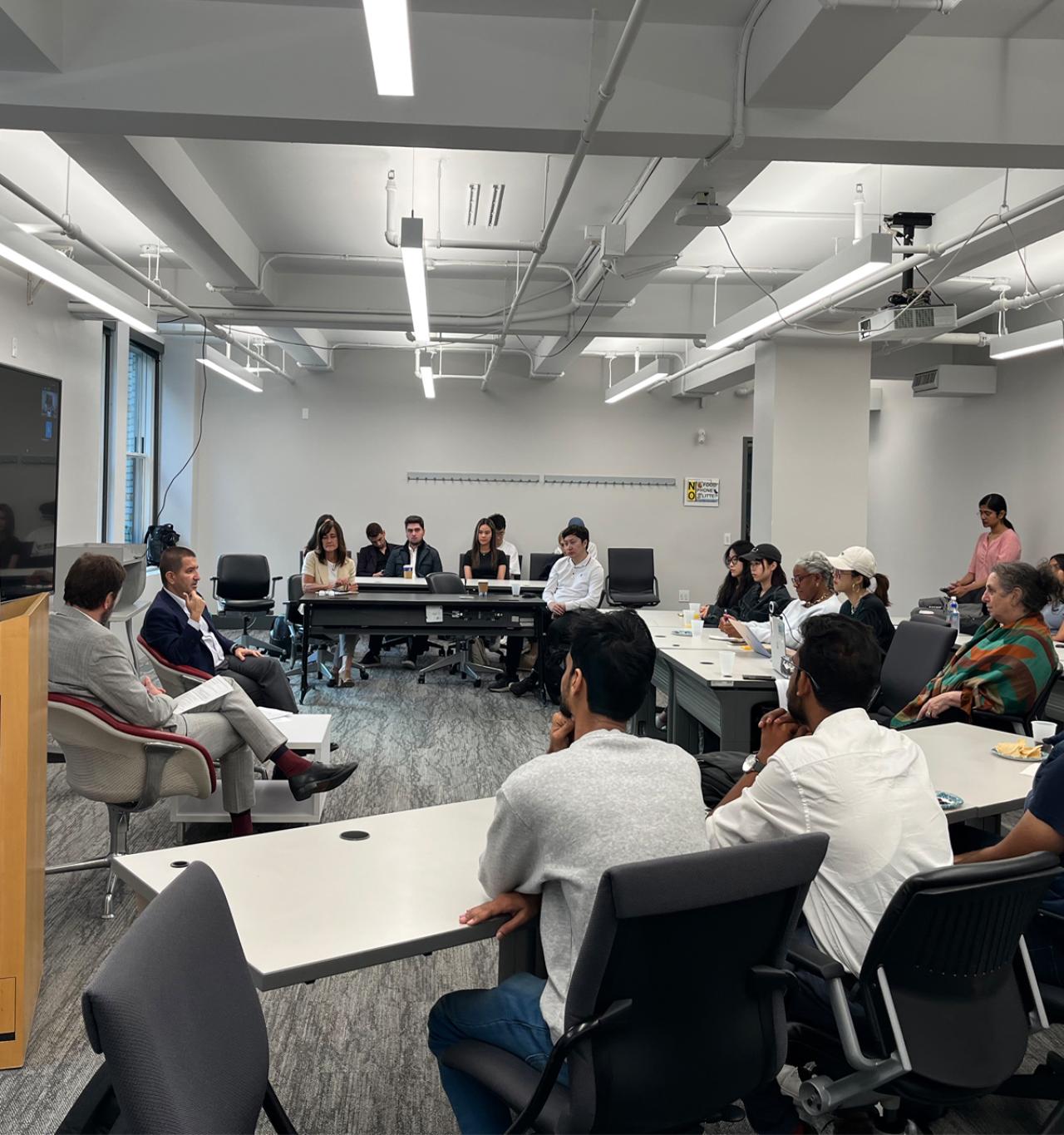 A group of students sit in a class.