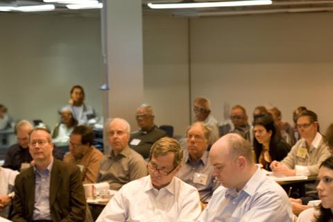 A seated crowd listens to a preentation at the State and Local Taxation Conference at NYU SPS.