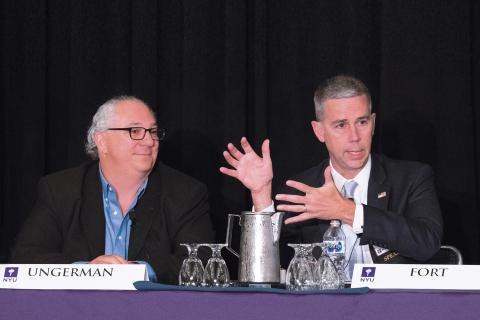 Two panelists engage with an audience at the Tax Controversy Forum, held at NYU SPS.