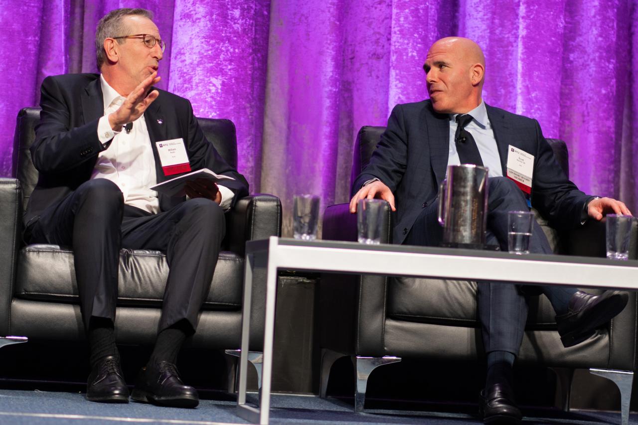 Two real estate professionals participate in a panel dsicussion at the Capital Markets in Real Estate Conference at NYU SPS.