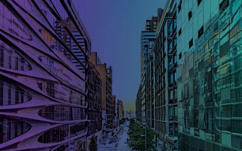 Modern glass buildings lining a New York City street at dusk, featured in promotional imagery for the NYU SPS National Conference on Real Estate Development.