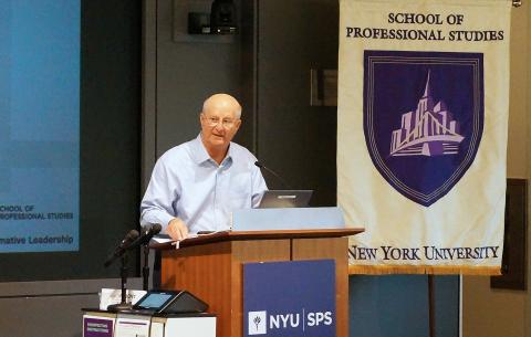 Dean Gennaro speaking at podium
