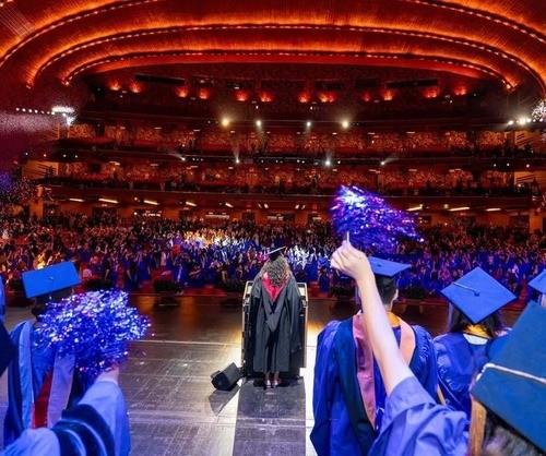 2026 NYU SPS grads celebrate at a Radio City Music Hall Convocation ceremony.