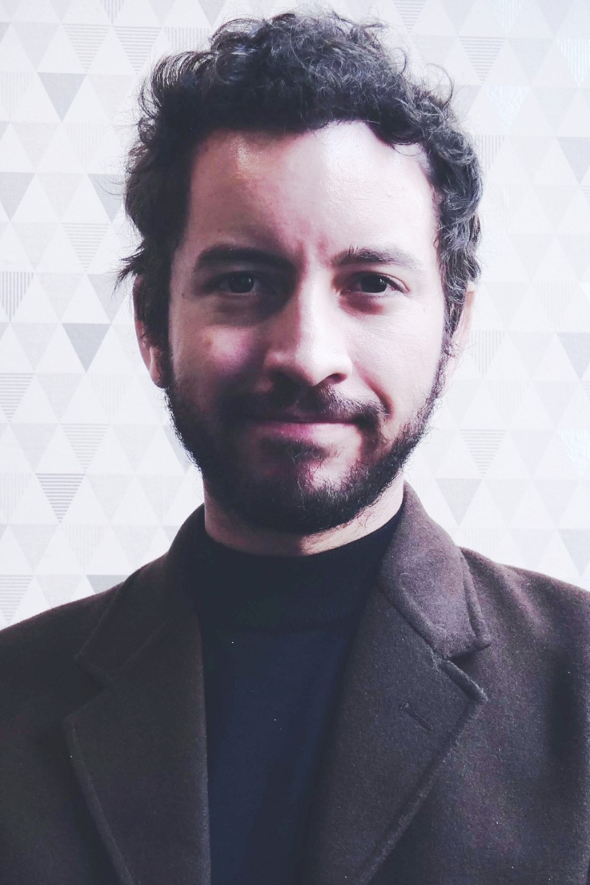 Lukas Mejia in a professional jacket, Center for Global Affairs at NYU SPS alumnus.