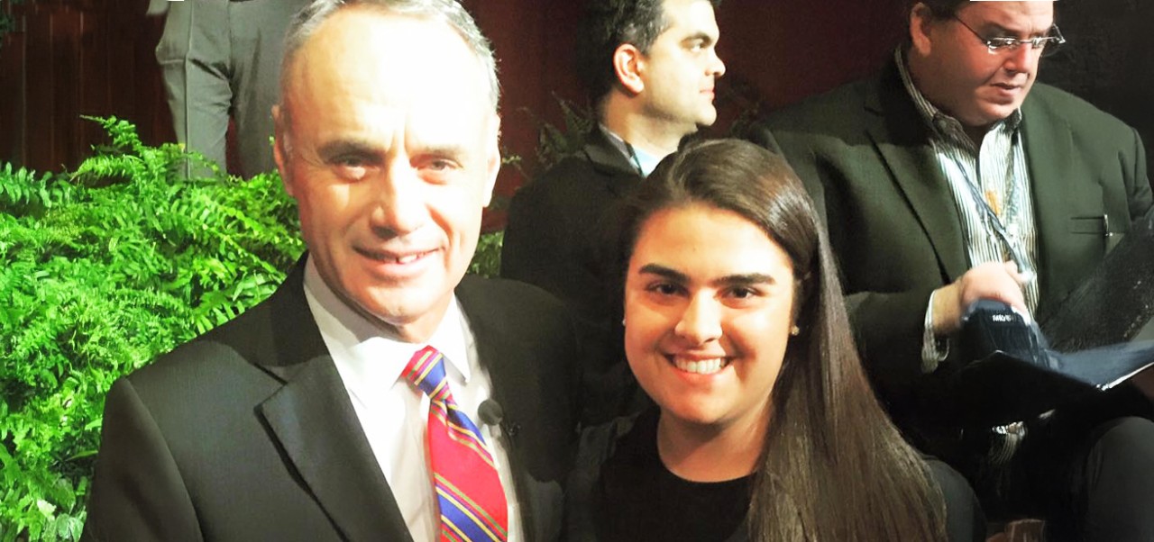 Reno Rismondo, Preston Robert Tisch Institute for Global Sport at NYU SPS alumnus, poses for a photo with a colleague.