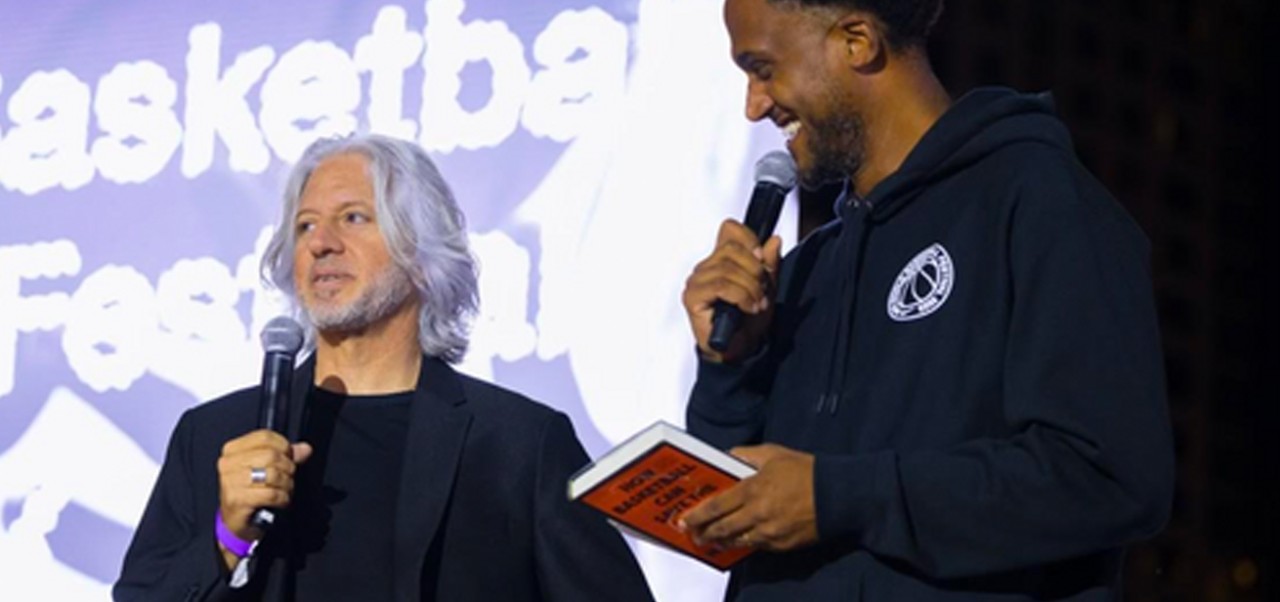 David Hollander and another speaker stand on a stage during a keynote at Nike World Basketball Festival, Lincoln Center, September 2023