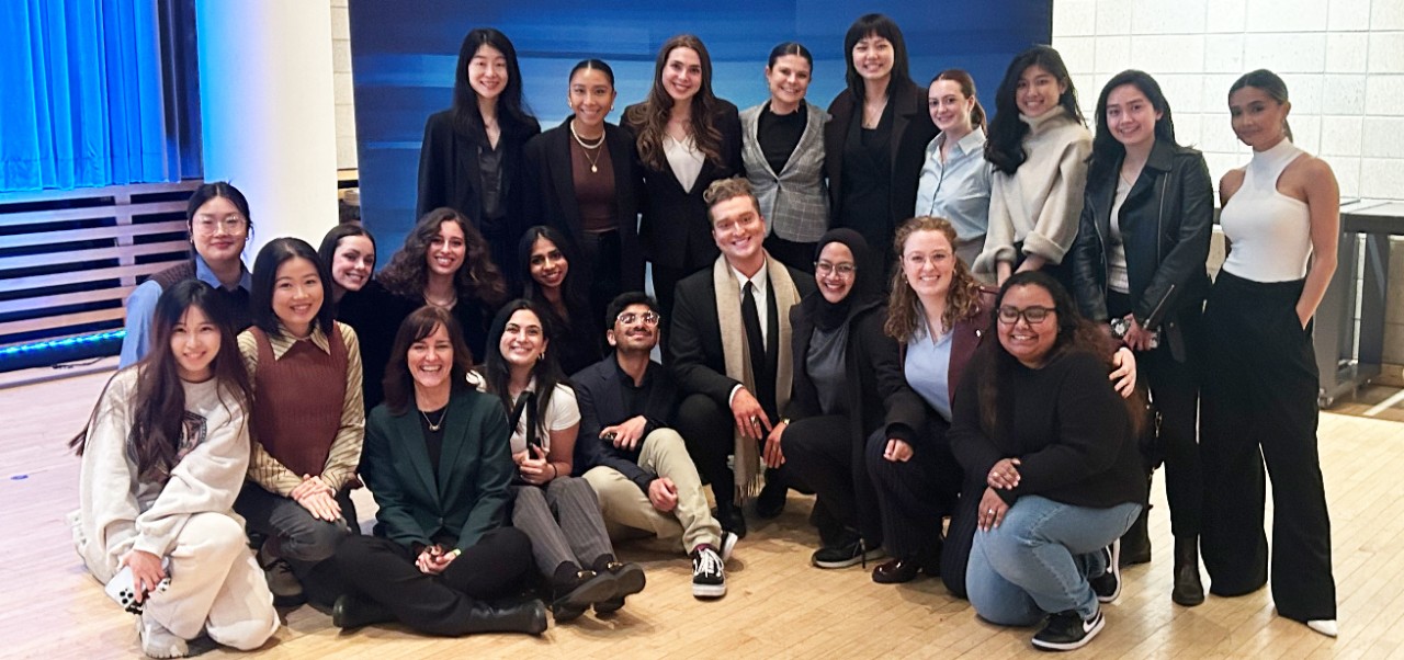 Kathleen Rennie, Clinical Assistant Professor of Marketing and Public Relations, Division of Programs in Business at NYU SPS, poses for a photo with colleagues