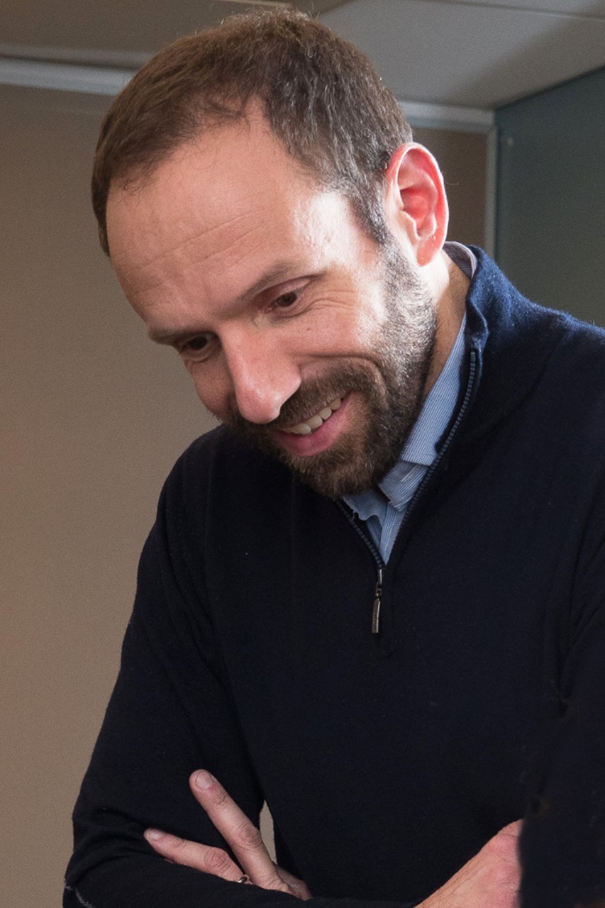 Headshot of Lee Igel smiling in professional attire.