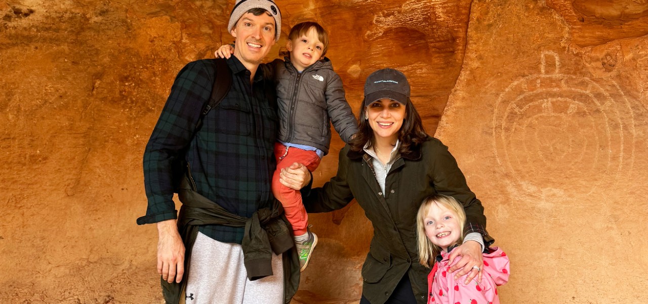 Stephanie Wright, Clinical Assistant Professor of Finance at the Schack Institute of Real Estate, NYU SPS, poses for a photo while rock climbing with family.