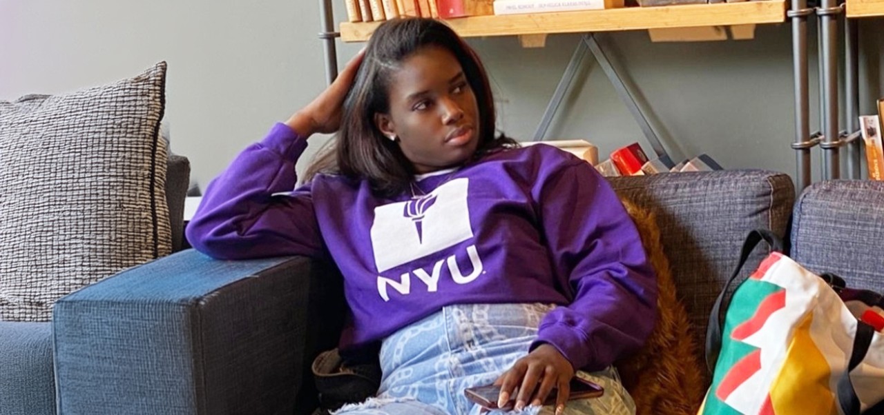 Wanda Bryce, student at the Division of Applied Undergraduate Studies, NYU SPS, relaxes in her dorm room.