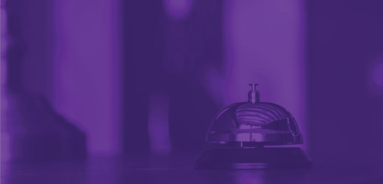 A woman smiles at the camera while standing in front of the Westin Hotel in Union Square, Manhattan.