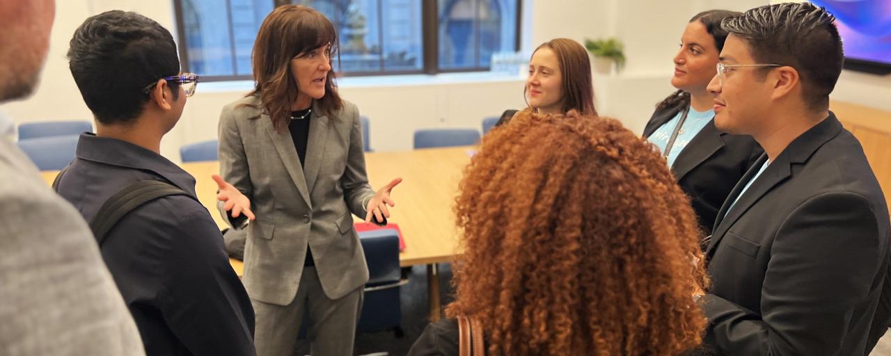 Kathleen Rennie speaking with Integrated Marketing students at the Innovation Challenge at Bliss Group headquarters.