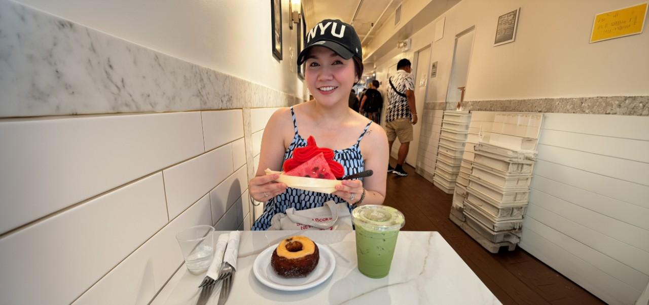 Siriluck Mim Rattanawaropas, NYU SPS Division of Programs in Business alumnus, eats a bowl of watermelon in a no-frills eatery.
