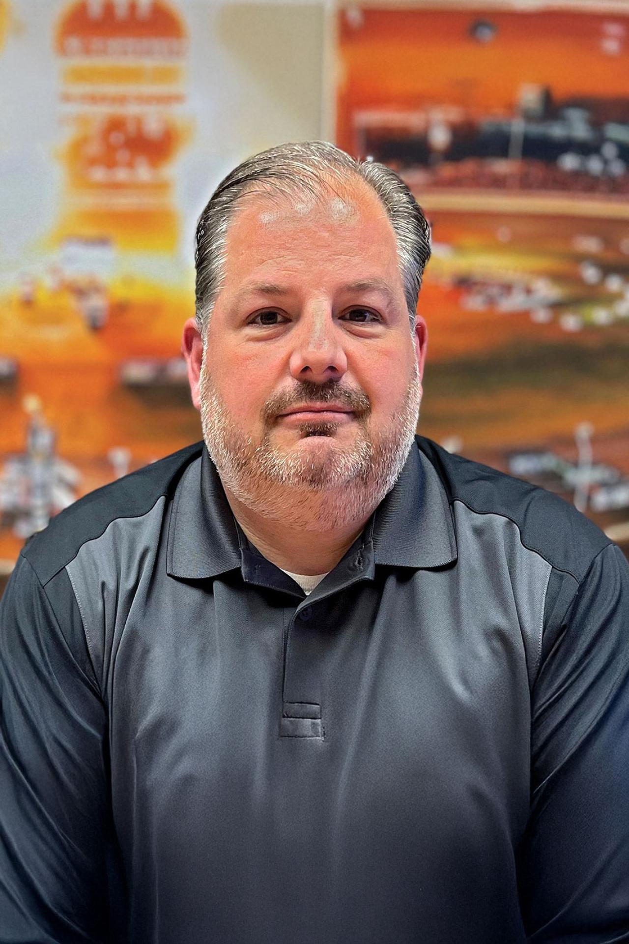 NYU SPS CE faculty member Charles Mellilo smiles for a headshot