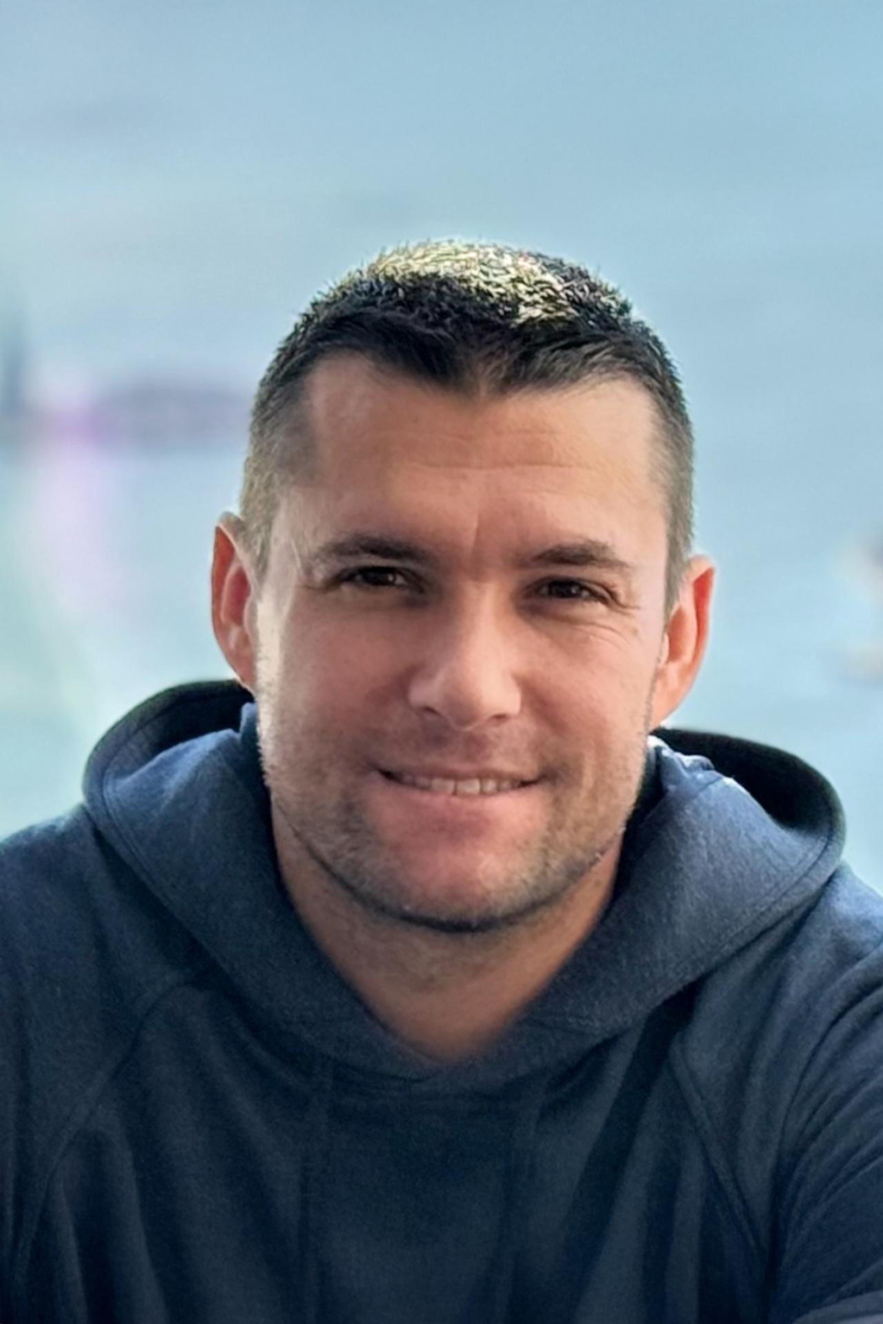 NYU SPS CE instructor Justin Redmond smiles for a photo