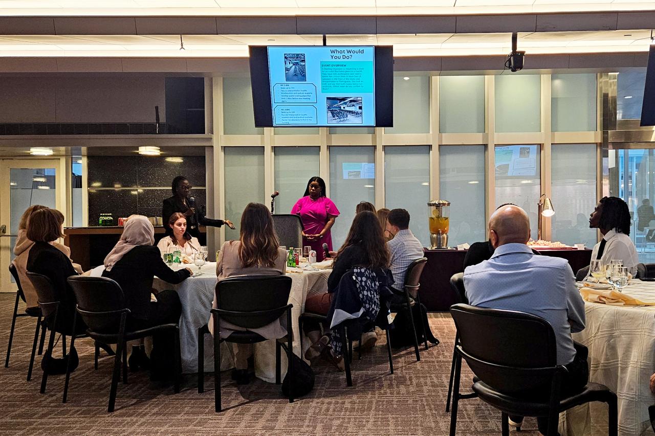 A group of Ronald Naples' students attend the International Association of Conference Centers and listen to executives give a presentation
