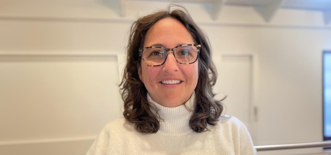 Amy Neu in eyeglasses smiling