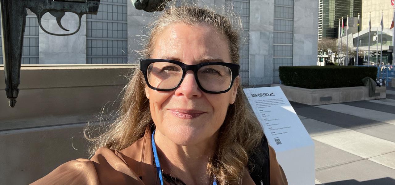 Anne Marie Goetz poses for a selfie outside of the United Nations before an event in NYC.