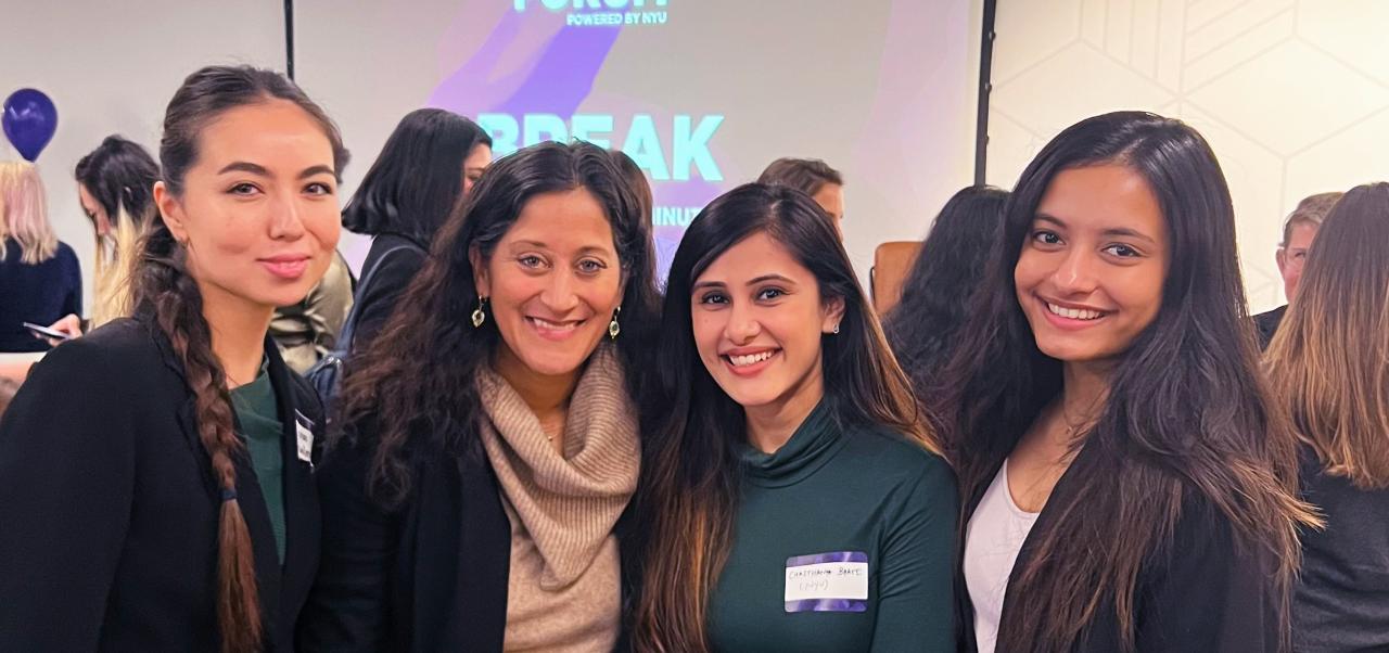NYU SPS student Chaithanya Bhathi poses for a photo with three other women at a university event