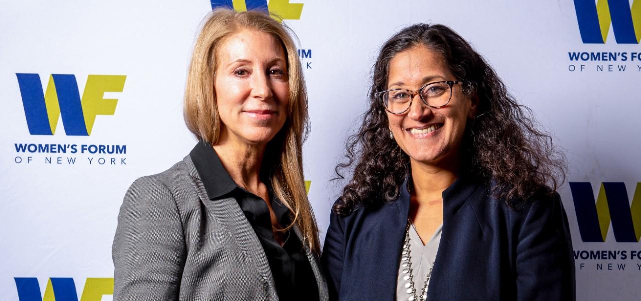 Julia Anelli, student in the Division of Applied Undergraduate Studies at NYU SPS, poses for a photo with a colleague at the Women's forum of New York.