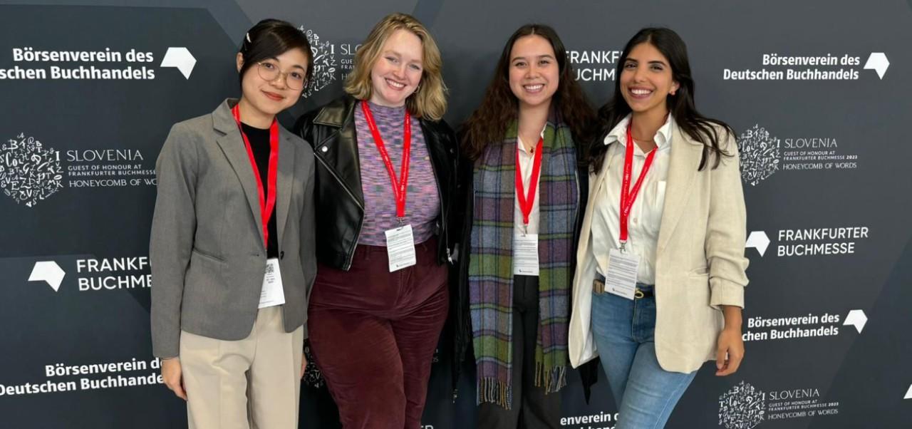 Ruby Chan, student at the Center for Publishing and Applied Liberal Arts, NYU SPS, poses for a photo with three friends at a step and repeat gala.