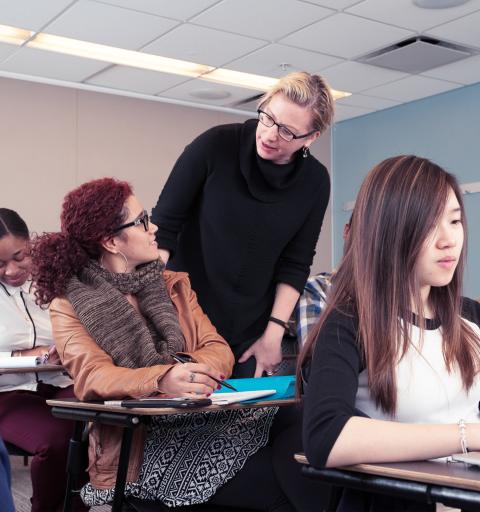 A professor mentoring a young female student, offering guidance and support in an academic setting